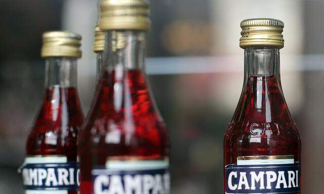 Campari's mignon bottles are is seen in a window of 'The Camparino'  bar historically known as the bar of the Campari brand downtown Milan