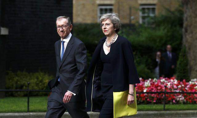 Britain´s Prime Minister, Theresa May, and husband Philip walk up Downing Street, in central London