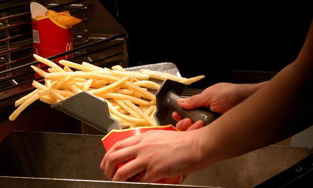 FILE PHOTO: An employee cooks French fries at a McDonald's restaurant in Moscow