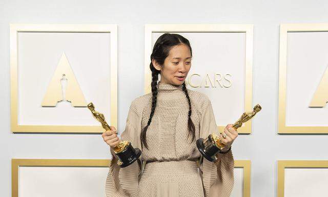 April 25, 2021, Los Angeles, California, USA: Chlo Zhao poses backstage with the Oscars for Directing and Best Picture