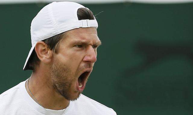 Jurgen Melzer of Austria reacts during his men's singles tennis match against Jerzy Janowicz of Poland at the Wimbledon Tennis Championships, in London