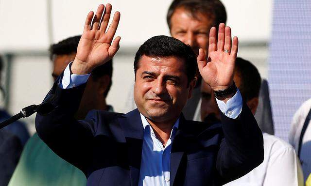 Selahattin Demirtas, co-leader of the pro-Kurdish Peoples' Democratic Party (HDP), greets the crowd during a peace rally to protest against Turkish military operations in northern Syria, in Istanbul