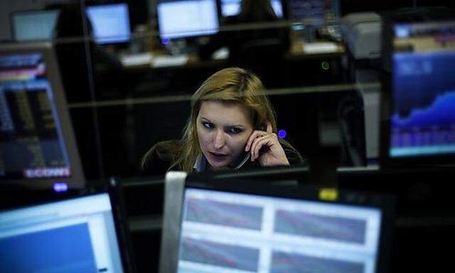 Cristina Povoa, a Portuguese broker,  talks on the phone while working Monday, Jan. 10, 2011 in Lisbo