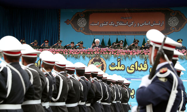 Iranian President Hassan Rouhani watches the National Army Day ceremony parade in Tehran