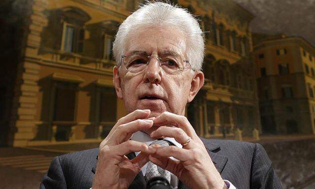 Italy's outgoing Prime Minister Monti gestures during a news conference in Rome