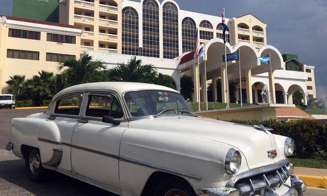 160629 HAVANA June 29 2016 A vintage car passes the Hotel Four Points by Sheraton in Havan