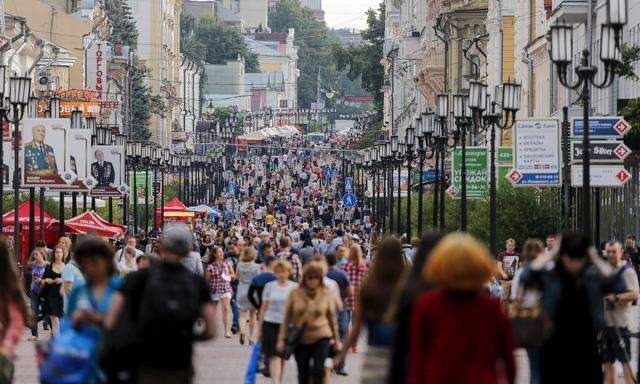 File photo of people walk on a street in the town of Nizhny Novgorod, Russia