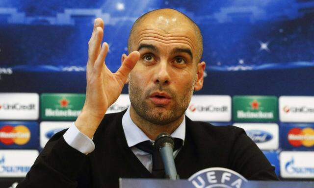 Bayern Munich´s coach Pep Guardiola addresses a news conference at the team´s hotel in Madrid