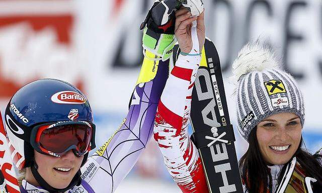 Shiffrin from the U.S. and Fenninger of Austria celebrate after winning the World Cup Soelden Women's Giant Slalom race on the Rettenbach glacier in the Tyrolean ski resort of Soelden