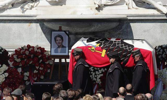 Flag draped casket of late Austrian Parliament President Prammer is carried out of parliament during a state ceremony in Vienna