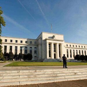 A police officer keeps watch in front of the U.S. Federal Reserve in Washington